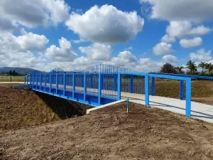 Laurent Swale Footbridge with fluffy clouds