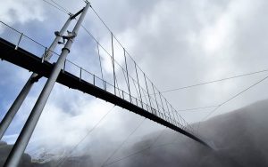 Manganui gorge suspension bridge with mist and clouds