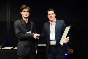 DC Structures Studio's Lucus Mactier accepting the SESOC 2025 Supreme Award